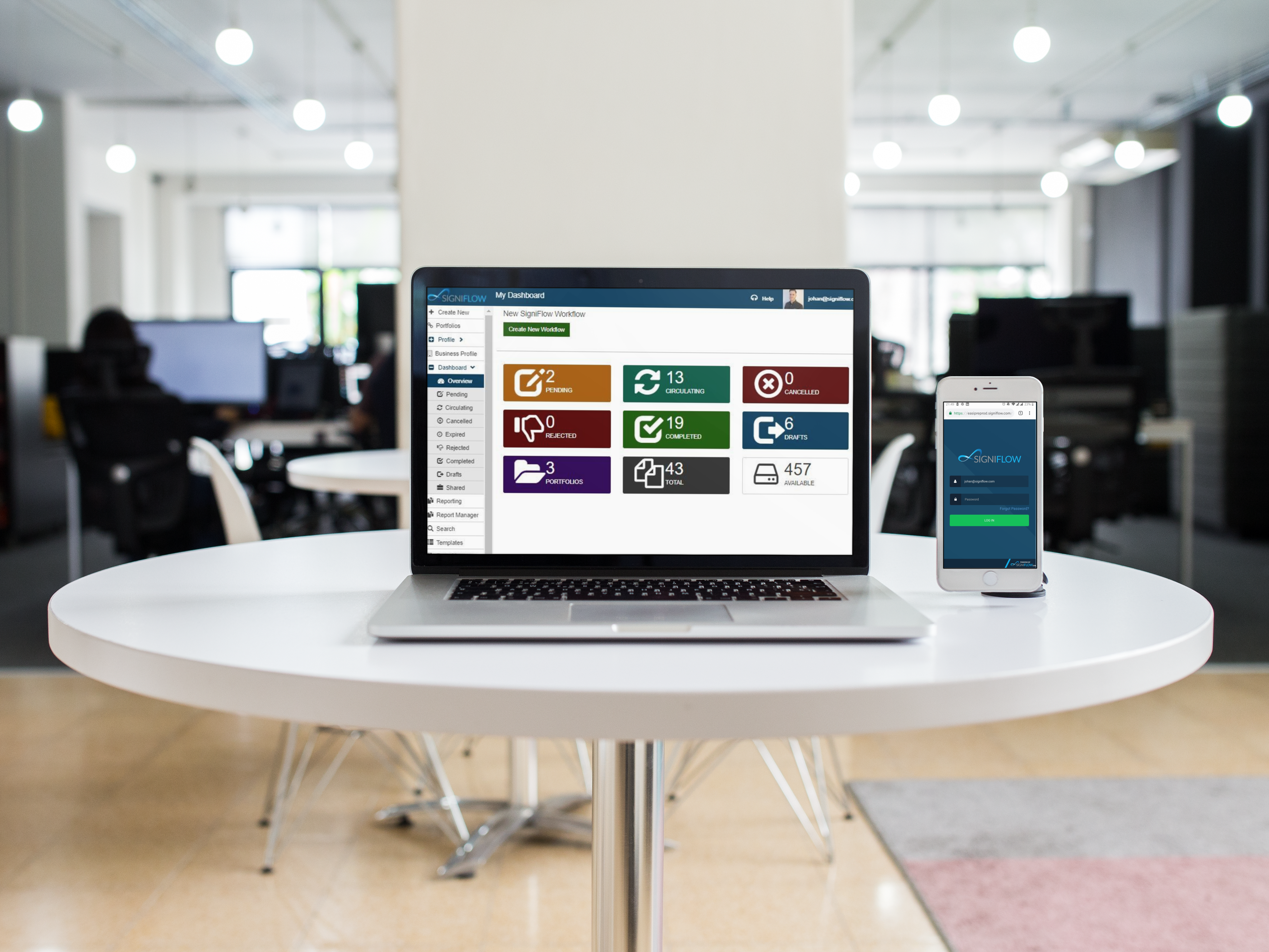 mockup-of-a-macbook-pro-iphone-on-a-white-round-table-in-an-office-space-a12367 mockup-of-a-macbook-pro-iphone-on-a-white-round-table-in-an-office-space-a12367